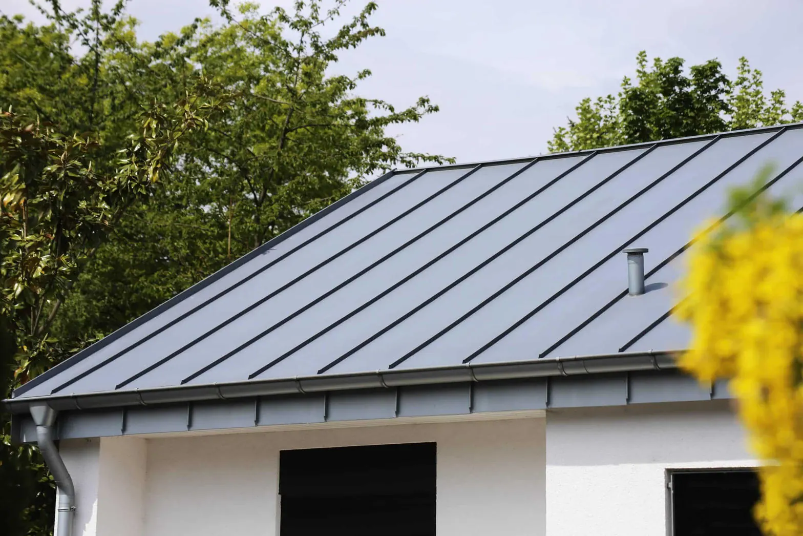 Standing seam metal roof panels on a residential home